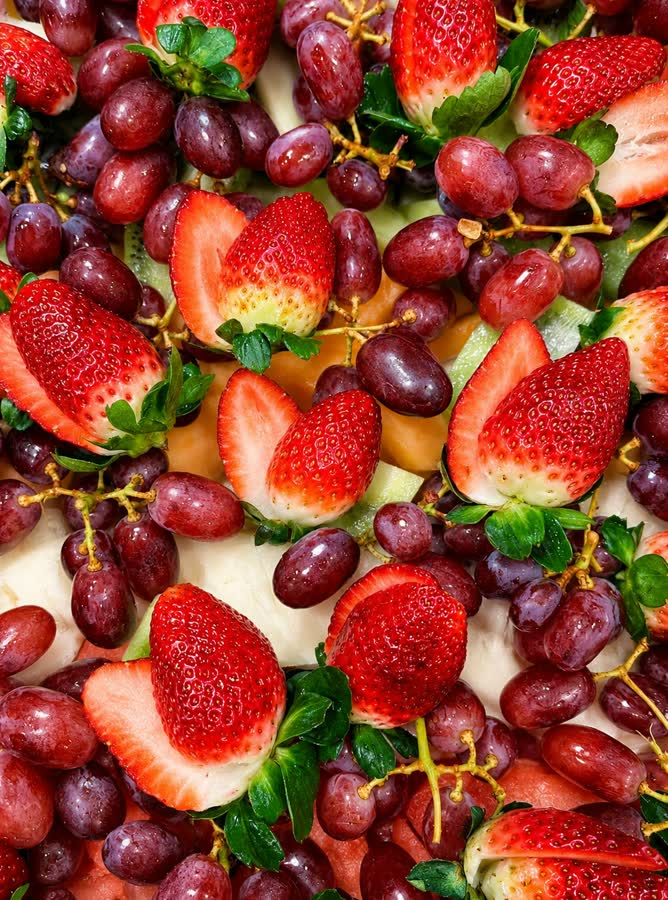 Fresh strawberries, grapes and cut fruit