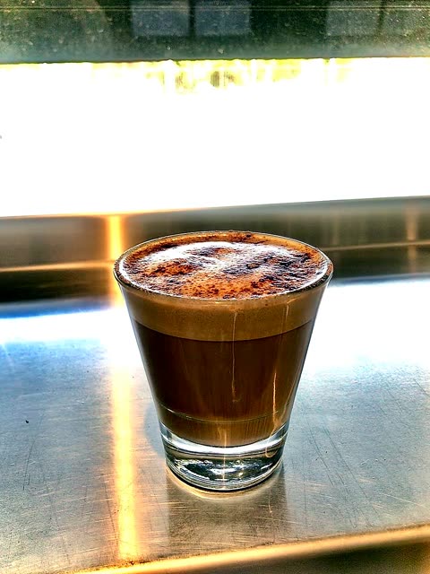Piccolo coffee on the stainless counter